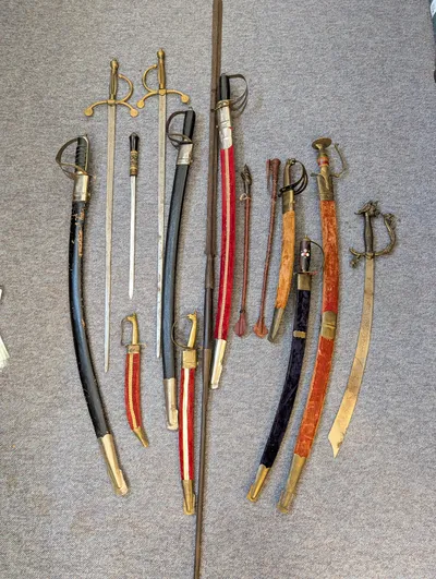 Collection of Antique and Decorative Swords, Sabers, and Daggers