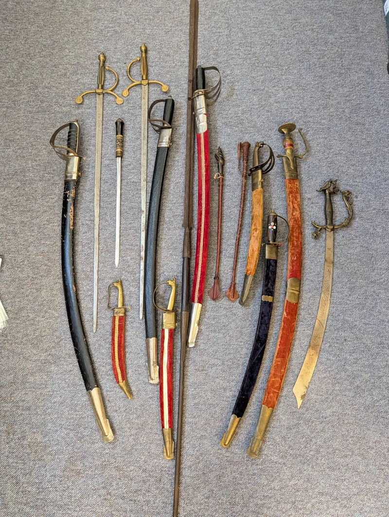 Collection of Antique and Decorative Swords, Sabers, and Daggers