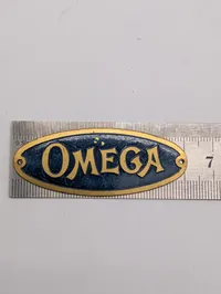 Vintage Omega messingskilt