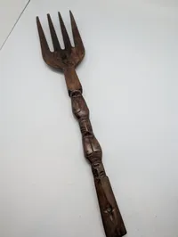 Collection of Four Hand-Carved African Ebony Wood Sculptures and Utensil