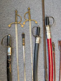 Collection of Antique and Decorative Swords, Sabers, and Daggers