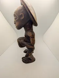 Hand-Carved African Wood Sculpture of a Drummer with Traditional Headdress