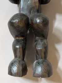 African Carved Dark Wood Fertility Figure with Brass Eye Inlays
