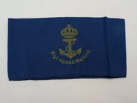 WW2 Marine armbind Armbindet blev fremstillet til Den danske Brigades Flotille, men nåede ikke at blive udleveret. Anvendt af Søværnet en periode umiddelbart efter besættelsen.