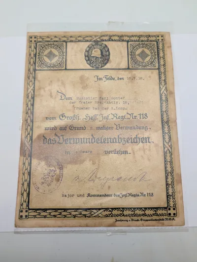 Tysk WWI Sårsmærke-certifikat til Musketér Karl Gonter, 1918