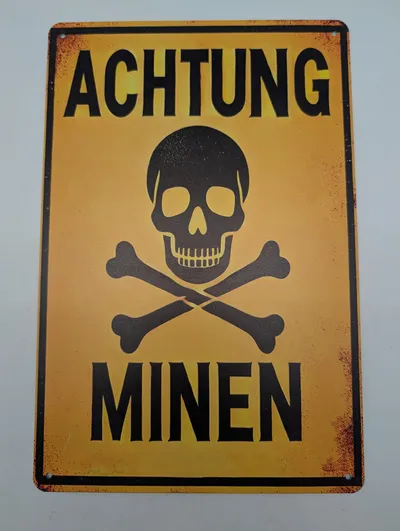 Achtung Minen metalskilt med kranium og korslagte knogler