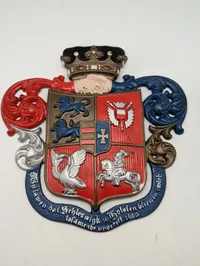 Støbejernsvåbenskjold med Slesvig-Holsten motiv og motto