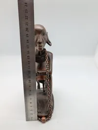 Collection of Four Hand-Carved African Ebony Wood Sculptures and Utensil