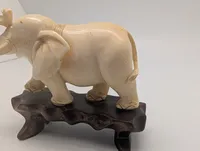 Vintage Carved Faux-Ivory Elephant Figurine on Wooden Stand