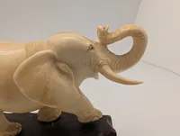 Vintage Carved Faux-Ivory Elephant Figurine on Wooden Stand