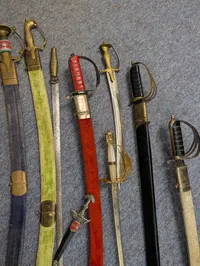 Collection of Nine Assorted Ceremonial Swords, Sabers, and Daggers