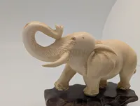 Vintage Carved Faux-Ivory Elephant Figurine on Wooden Stand