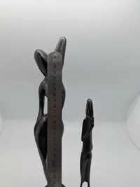 Collection of Four Hand-Carved African Ebony Wood Sculptures and Utensil