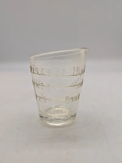 Antikt medicinglas i klart glas med måleenheder