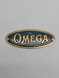 Vintage Omega messingskilt