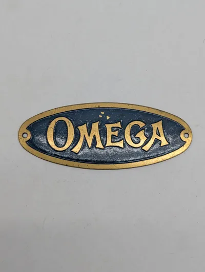 Vintage Omega messingskilt
