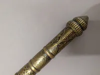 Antique Southeast Asian Dha Sword with Ornate Brass Hilt and Serrated Blade