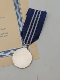 Finsk Lotta Svärd fortjenstmedalje med tilhørende diplom